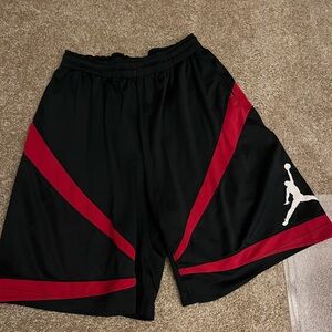 Black and red pair of Air Jordan